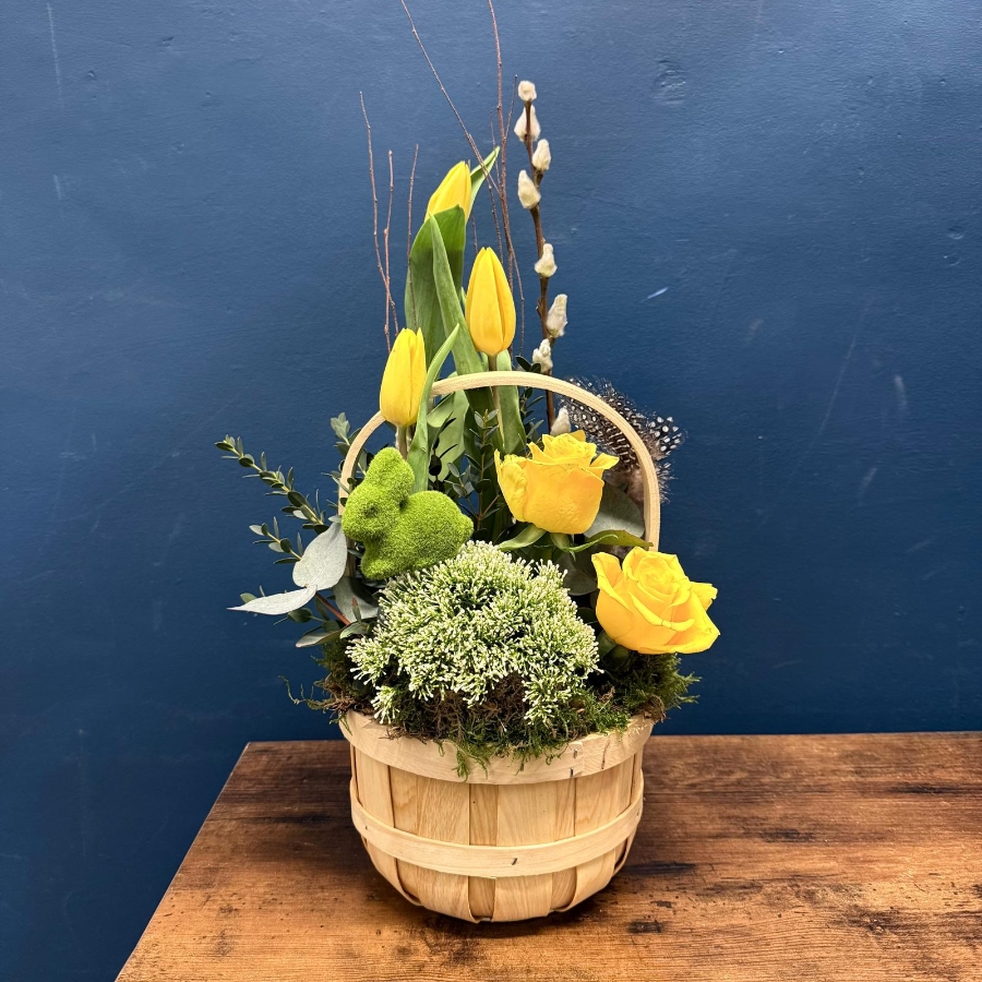 Spring flower basket with yellow and white seasonal flowers