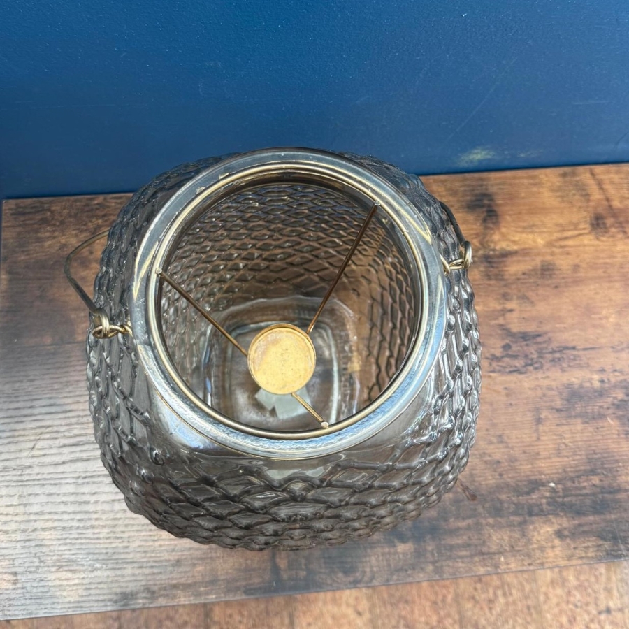 Pastel flower arrangement in glass lantern vase with gold frame tealight holder