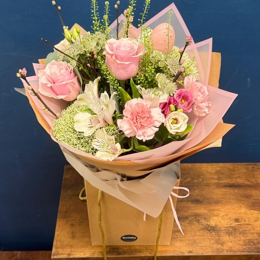 Soft pink spring bouquet with seasonal flowers