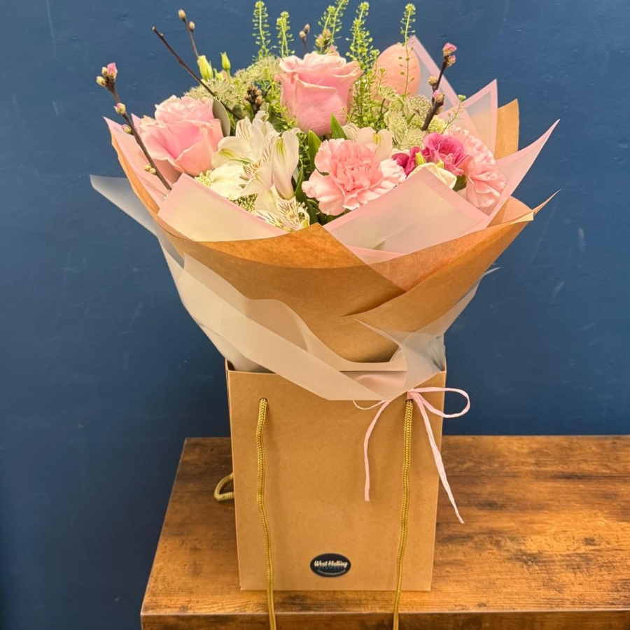 Soft pink spring bouquet with seasonal flowers