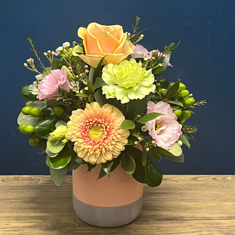 pastel peach and pink ceramic pot flower arrangement West Malling Flowers