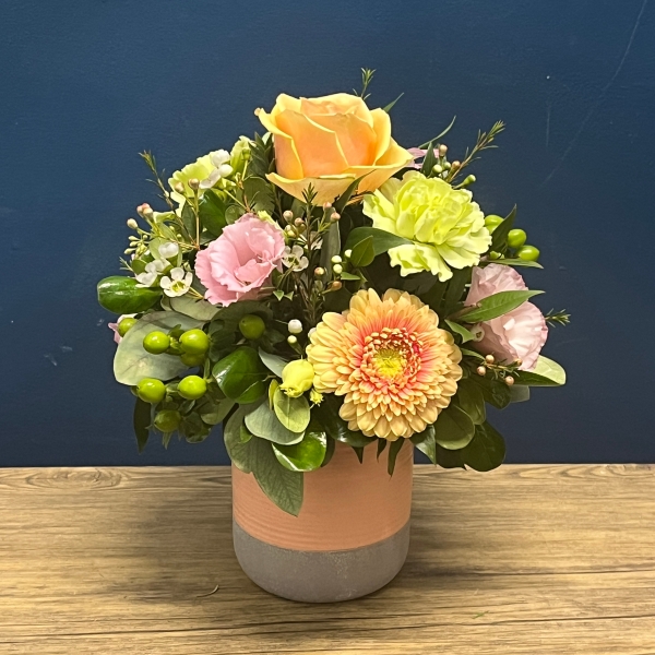 pastel peach and pink ceramic pot flower arrangement West Malling Flowers