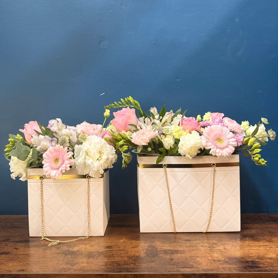 Mother’s Day flower arrangement in a white handbag gift container with soft pastel blooms, Paris collection West Malling florist