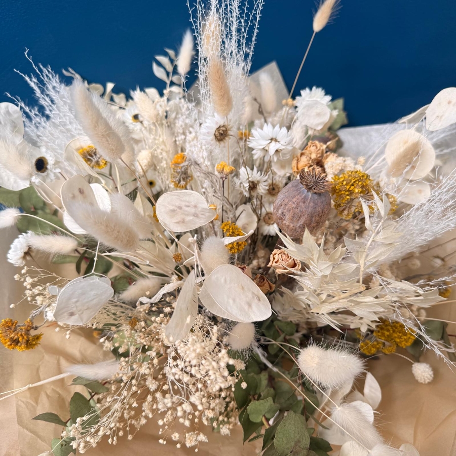 Natural dried flower bouquet with neutral preserved flowers grasses and textured stems