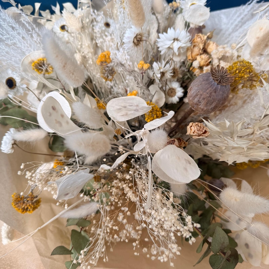 Natural dried flower bouquet with neutral preserved flowers grasses and textured stems