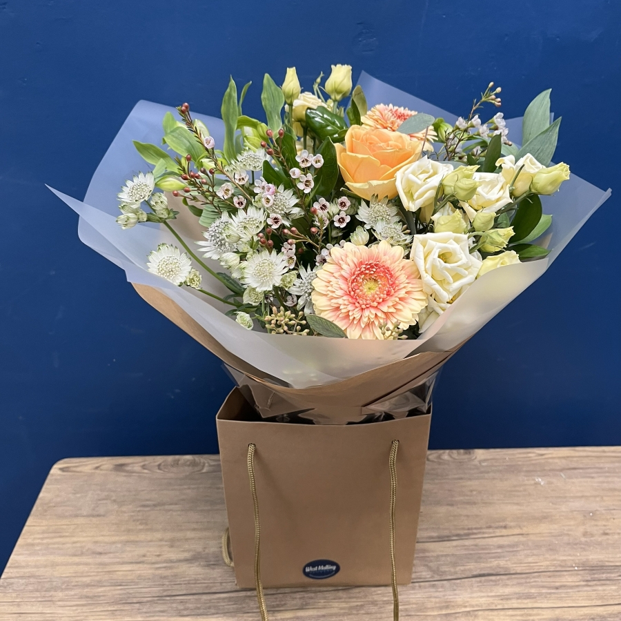 pastel peach and cream hand-tied bouquet from West Malling Flowers