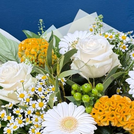 Lemon and white summer hand tied bouquet with seasonal flowers and fresh foliage