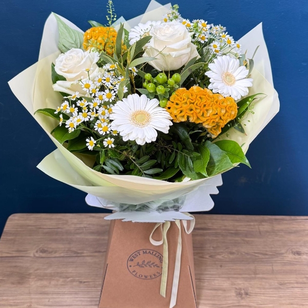 Lemon and white summer hand tied bouquet with seasonal flowers and fresh foliage