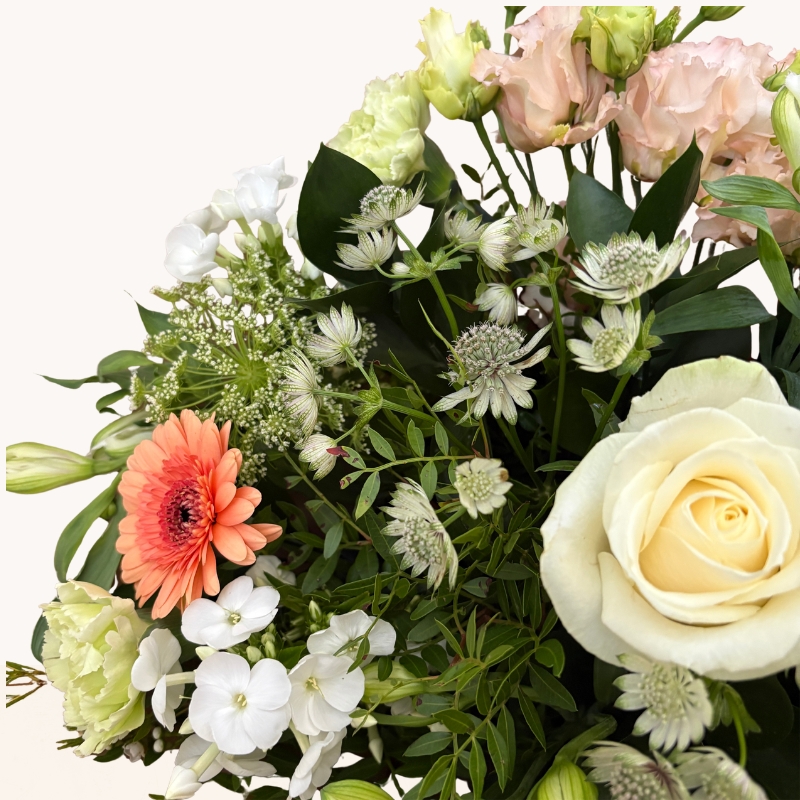 Late summer hand-tied bouquet with peach, cream and white seasonal flowers, fresh greenery and gift box.