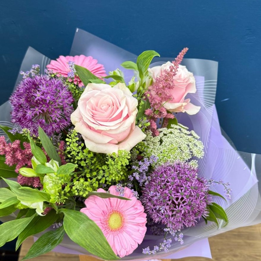 Pastel summer hand tied bouquet with pink lilac and purple seasonal flowers