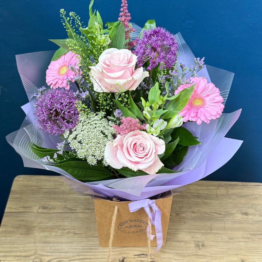 Pastel summer hand tied bouquet with pink lilac and purple seasonal flowers