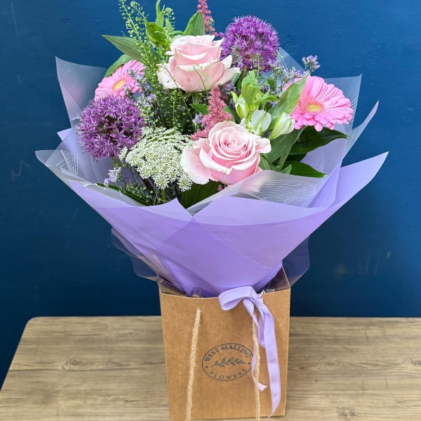 Pastel summer hand tied bouquet with pink lilac and purple seasonal flowers