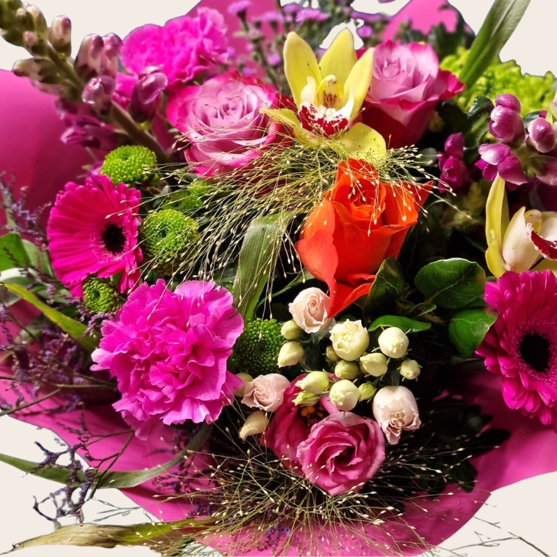 Bright summer hand tied bouquet with cerise purple orange and lime seasonal flowers