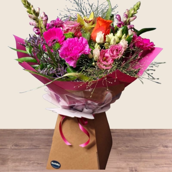 Bright summer hand tied bouquet with cerise purple orange and lime seasonal flowers