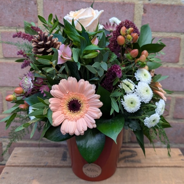 Autumn Haze ceramic pot arrangement with peach, blush, bronze and burgundy seasonal flowers