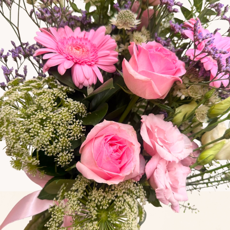 Summer Blush glass vase arrangement with pink roses, gerbera and soft pink, cream and lilac seasonal flowers