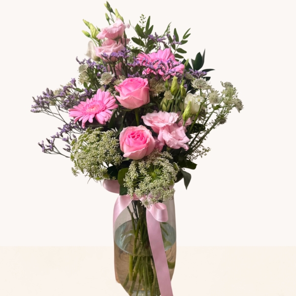 Summer Blush glass vase arrangement with pink roses, gerbera and soft pink, cream and lilac seasonal flowers