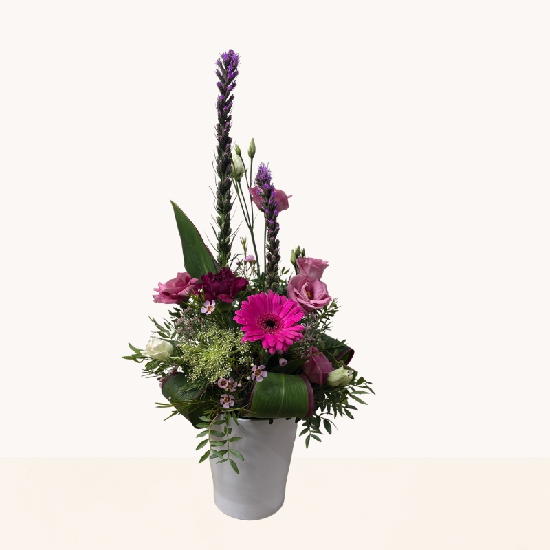 Summer Splash ceramic pot arrangement with vibrant pink and purple seasonal flowers by West Malling Flowers