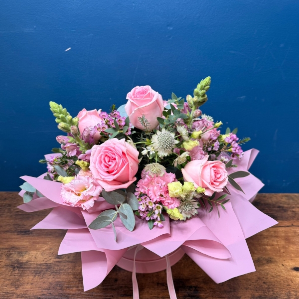 Pink hat box flower arrangement for Mother’s Day with romantic pastel seasonal flowers, Paris collection West Malling florist