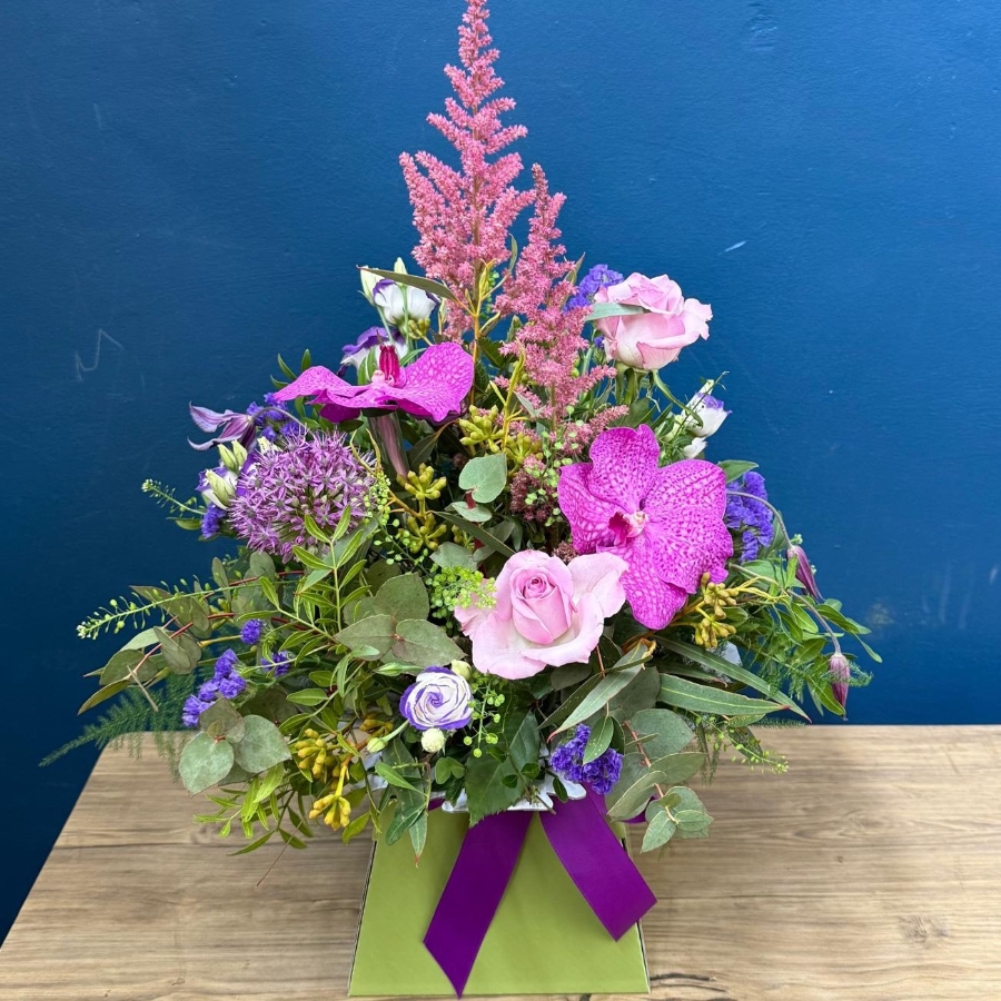 Summer flower box arrangement with pink lilac and purple seasonal flowers