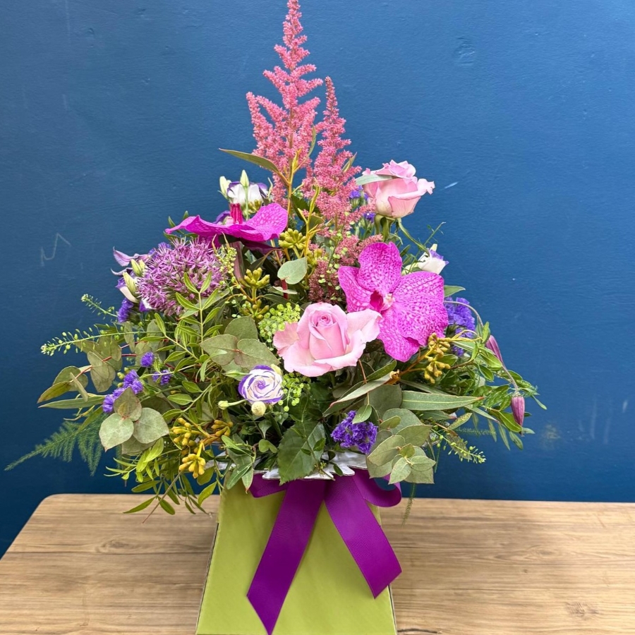 Summer flower box arrangement with pink lilac and purple seasonal flowers