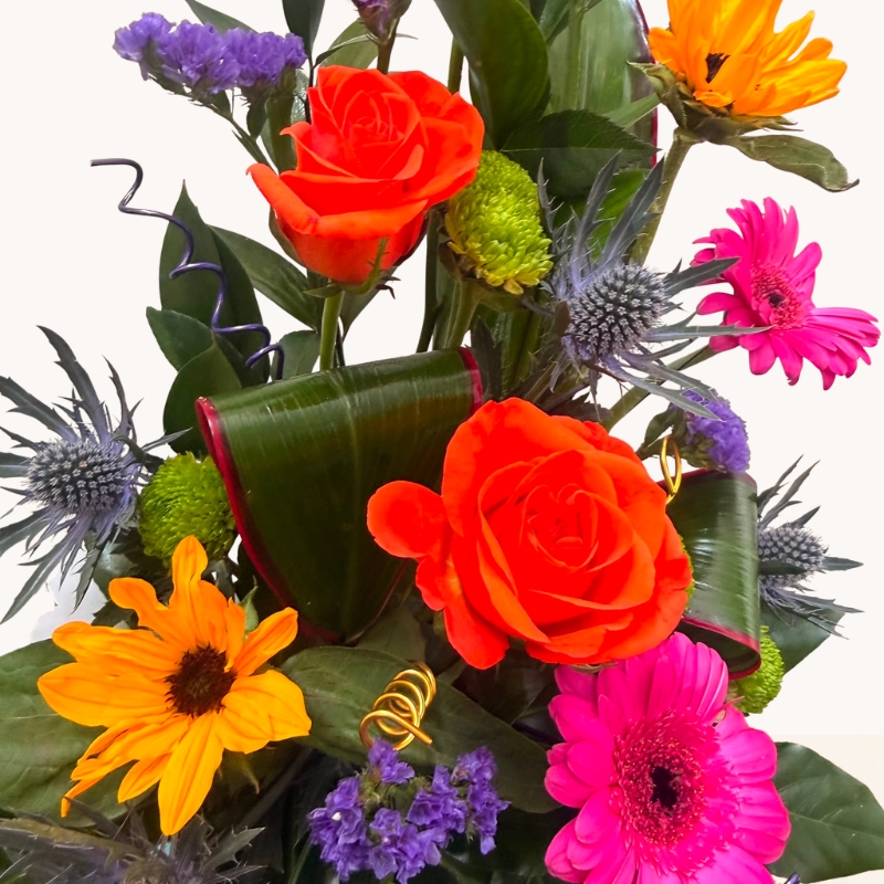 Summer Splash vibrant flower box arrangement with bright pink, orange, purple and blue seasonal flowers