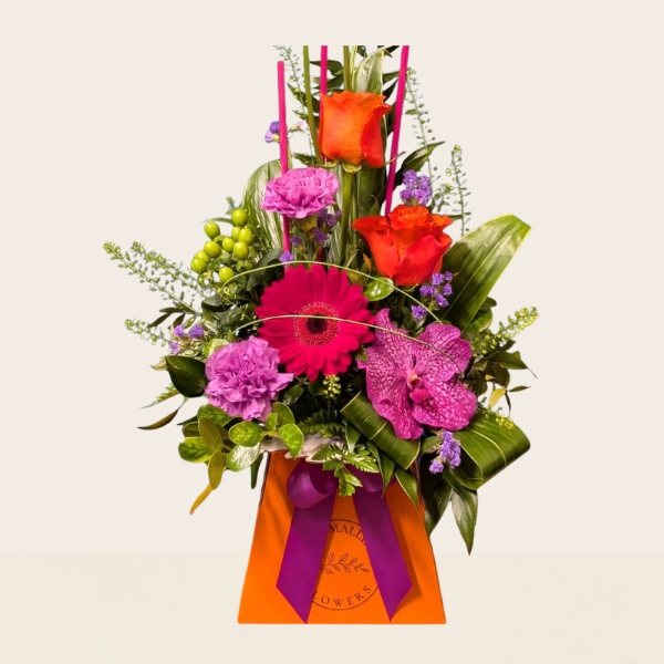 Summer flower box arrangement with pink lilac and purple seasonal flowers