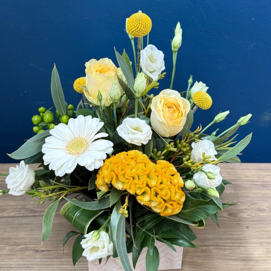 Citrus summer flower box arrangement with yellow white seasonal flowers in square box