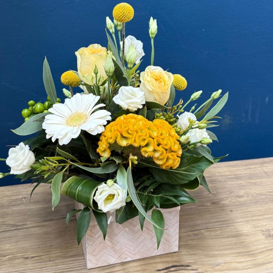 Citrus summer flower box arrangement with yellow white seasonal flowers in square box