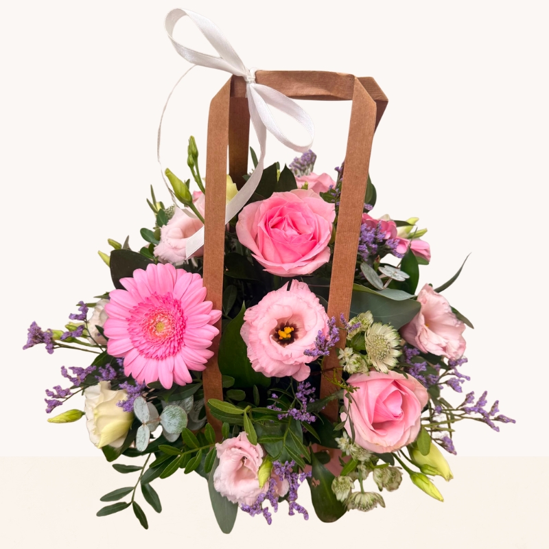 Summer Blush pink bag arrangement with pink roses, gerbera and soft pastel seasonal flowers