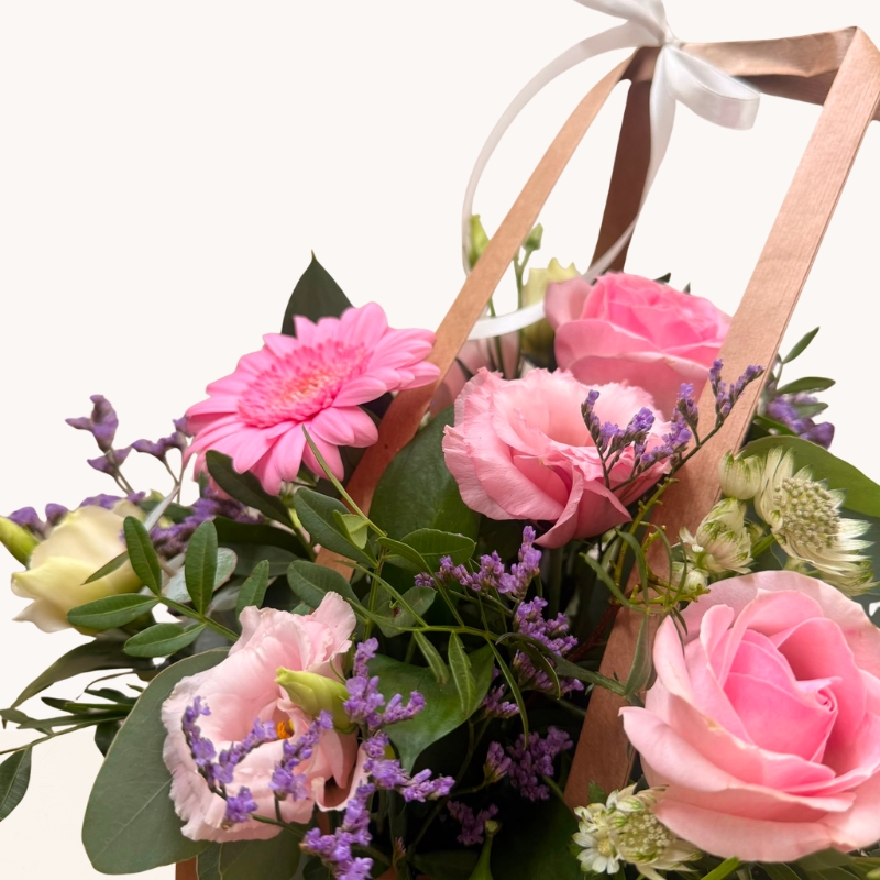 Summer Blush pink bag arrangement with pink roses, gerbera and soft pastel seasonal flowers