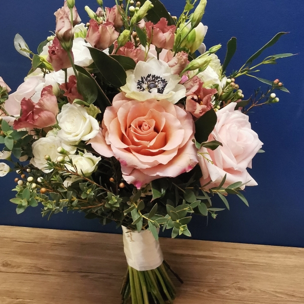 Rustic bridesmaid bouquet with deep red and burnt orange seasonal flowers