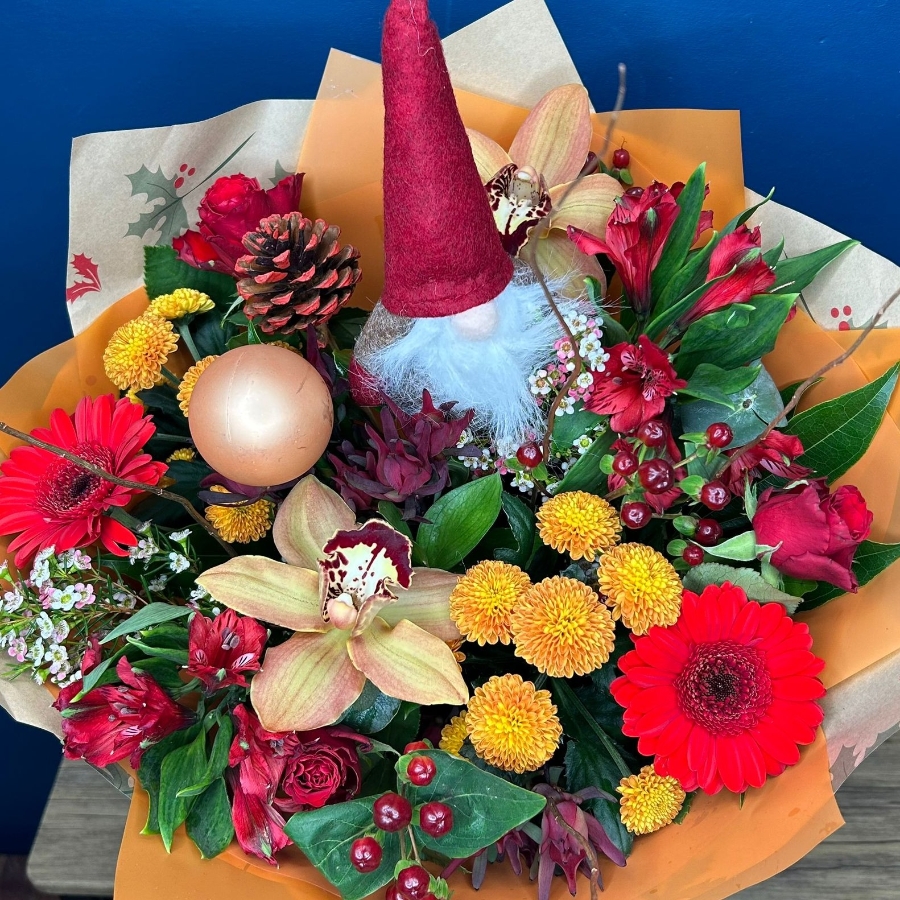 Christmas hand-tied bouquet with seasonal flowers by West Malling Flowers