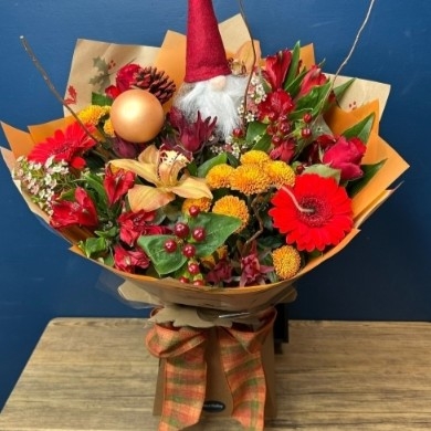 Christmas hand-tied bouquet with seasonal flowers by West Malling Flowers
