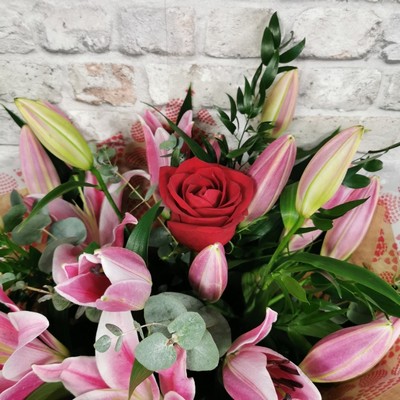 rose and lily Valentine’s bouquet arranged by West Malling Flowers