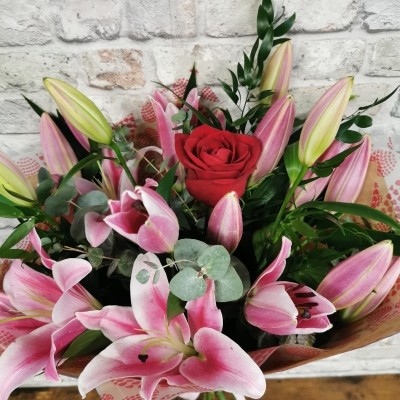 rose and lily Valentine’s bouquet arranged by West Malling Flowers