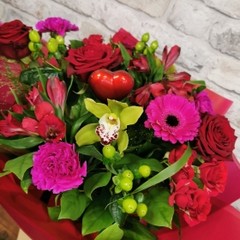 bold Valentine’s hand-tied bouquet with red and cerise flowers from West Malling Flowers