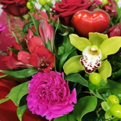 bold Valentine’s hand-tied bouquet with red and cerise flowers from West Malling Flowers