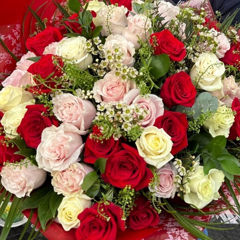 Luxury rose bouquet with 30 or 50 roses arranged as a large hand tied bouquet