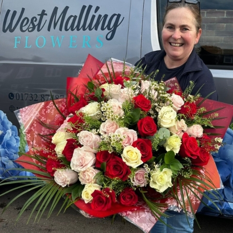 Luxury rose bouquet with 30 or 50 roses arranged as a large hand tied bouquet