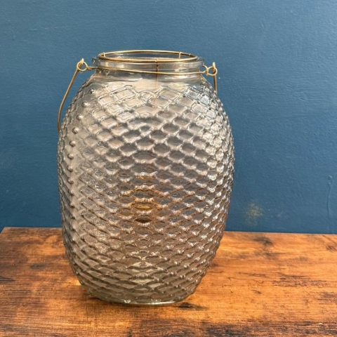 Pastel flower arrangement in glass lantern vase with gold frame tealight holder