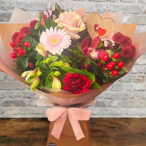 blush pink and burgundy Valentine’s hand-tied bouquet from West Malling Flowers
