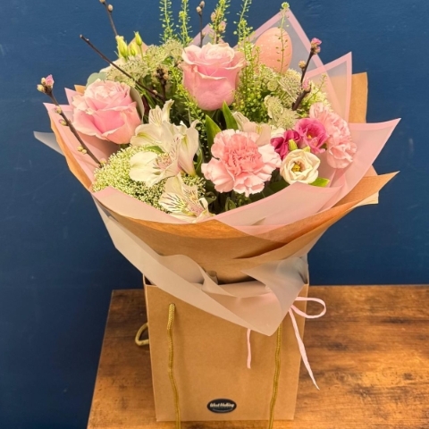 Soft pink spring bouquet with seasonal flowers