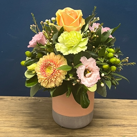 pastel peach and pink ceramic pot flower arrangement West Malling Flowers