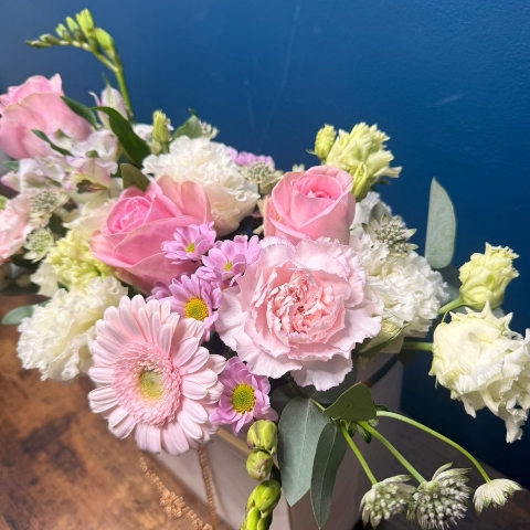 Mother’s Day flower arrangement in a white handbag gift container with soft pastel blooms, Paris collection West Malling florist