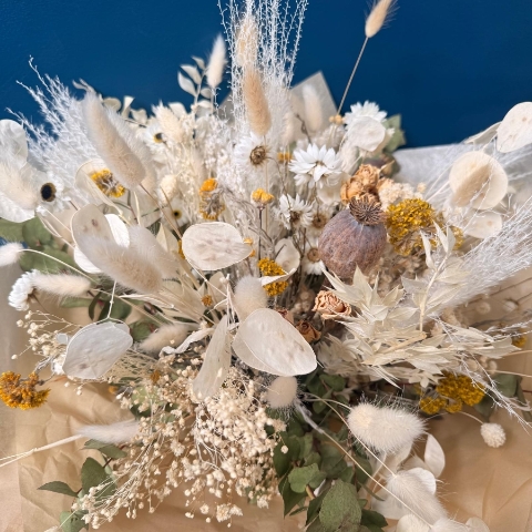 Natural dried flower bouquet with neutral preserved flowers grasses and textured stems