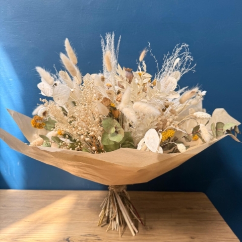 Natural dried flower bouquet with neutral preserved flowers grasses and textured stems