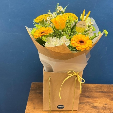 Yellow and white spring bouquet with seasonal flowers