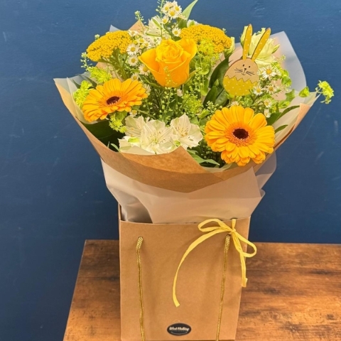 Yellow and white spring bouquet with seasonal flowers