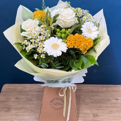 Lemon and white summer hand tied bouquet with seasonal flowers and fresh foliage